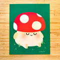 A square art print featuring a cute cartoon mushroom character with a red cap, white spots, and a cream body, placed on a green background and photographed flat on a light wood surface. The artist signature 'Lindsy Liu' is visible in the bottom right corner of the artwork.