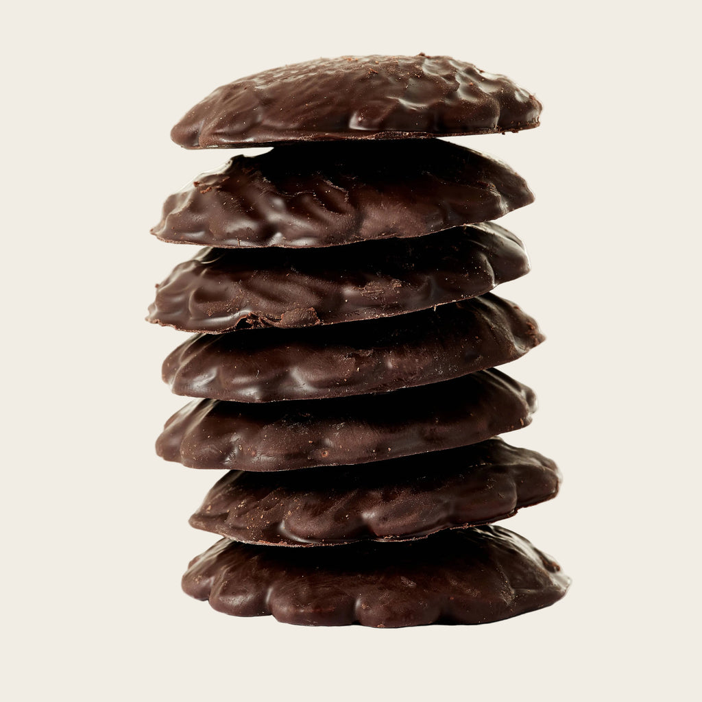 Stack of chocolate cookies on a white background