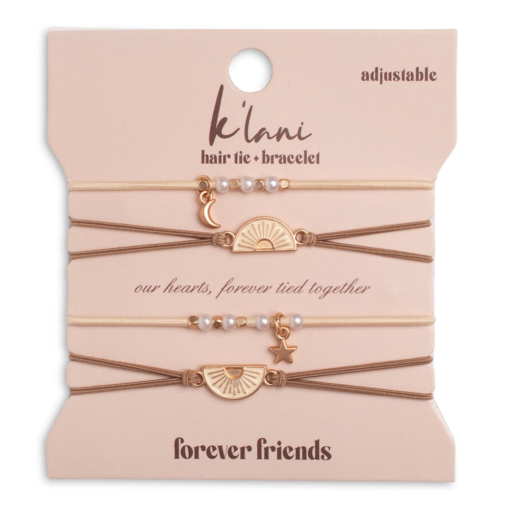 Four adjustable hair tie bracelets with pearl and gold charms, displayed on a beige card that reads 'k'lani hair tie + bracelet' and 'forever friends'.