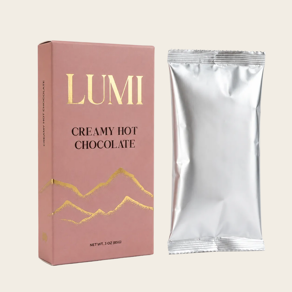 LUMI creamy hot chocolate packaging with a silver foil packet on a white background
