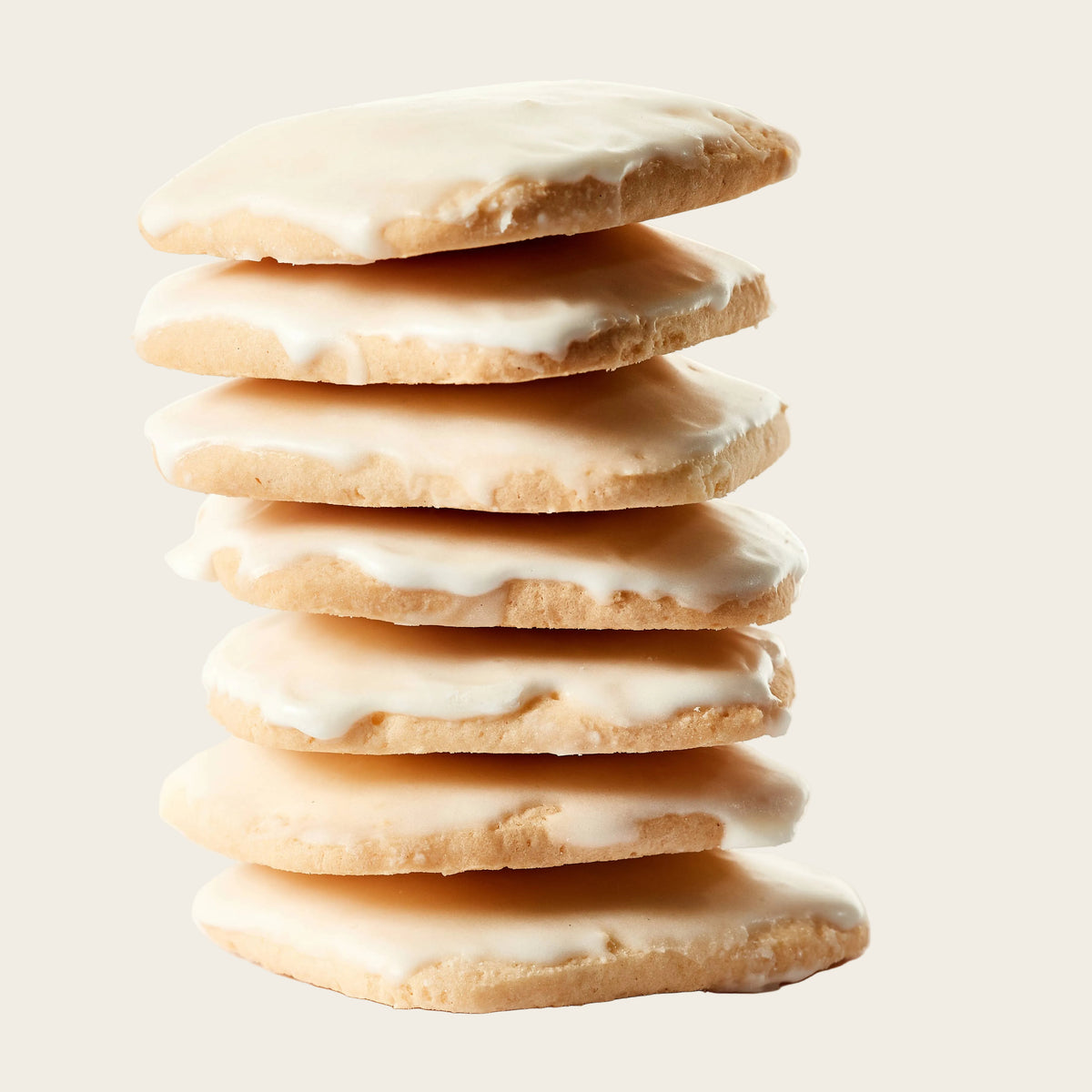 Stack of iced cookies on a white background