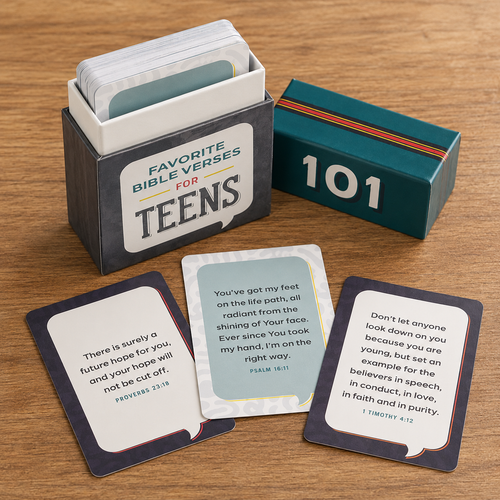 Bible verse cards for teens in a dark teal box with a matching lid, shown on a wooden tabletop. Three sample cards are fanned out in front, and a stack of cards is visible inside the box, by Christian Art Gifts.